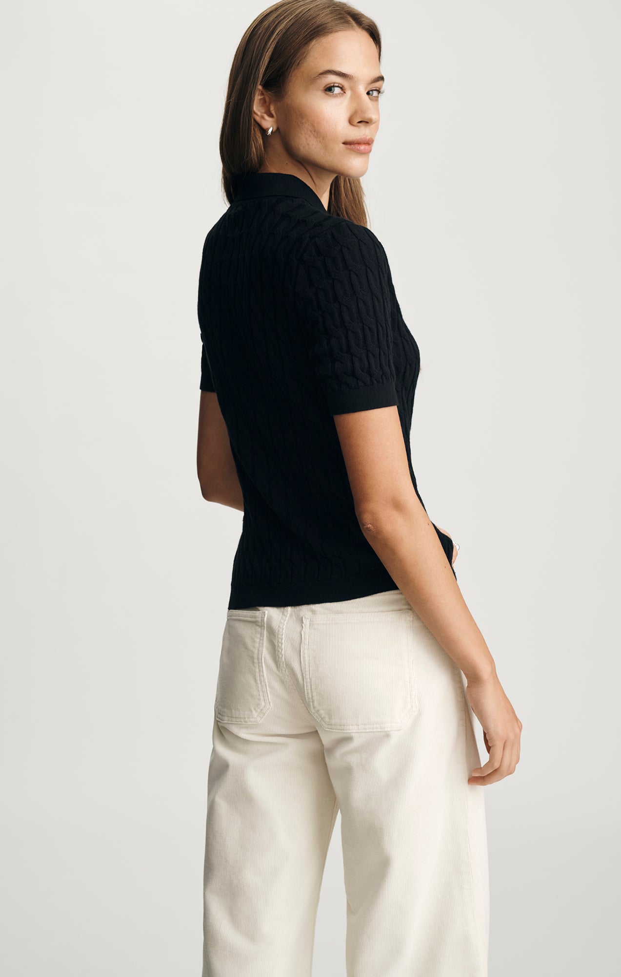 EDITION CABLE-KNIT POLO SWEATER IN BLACK