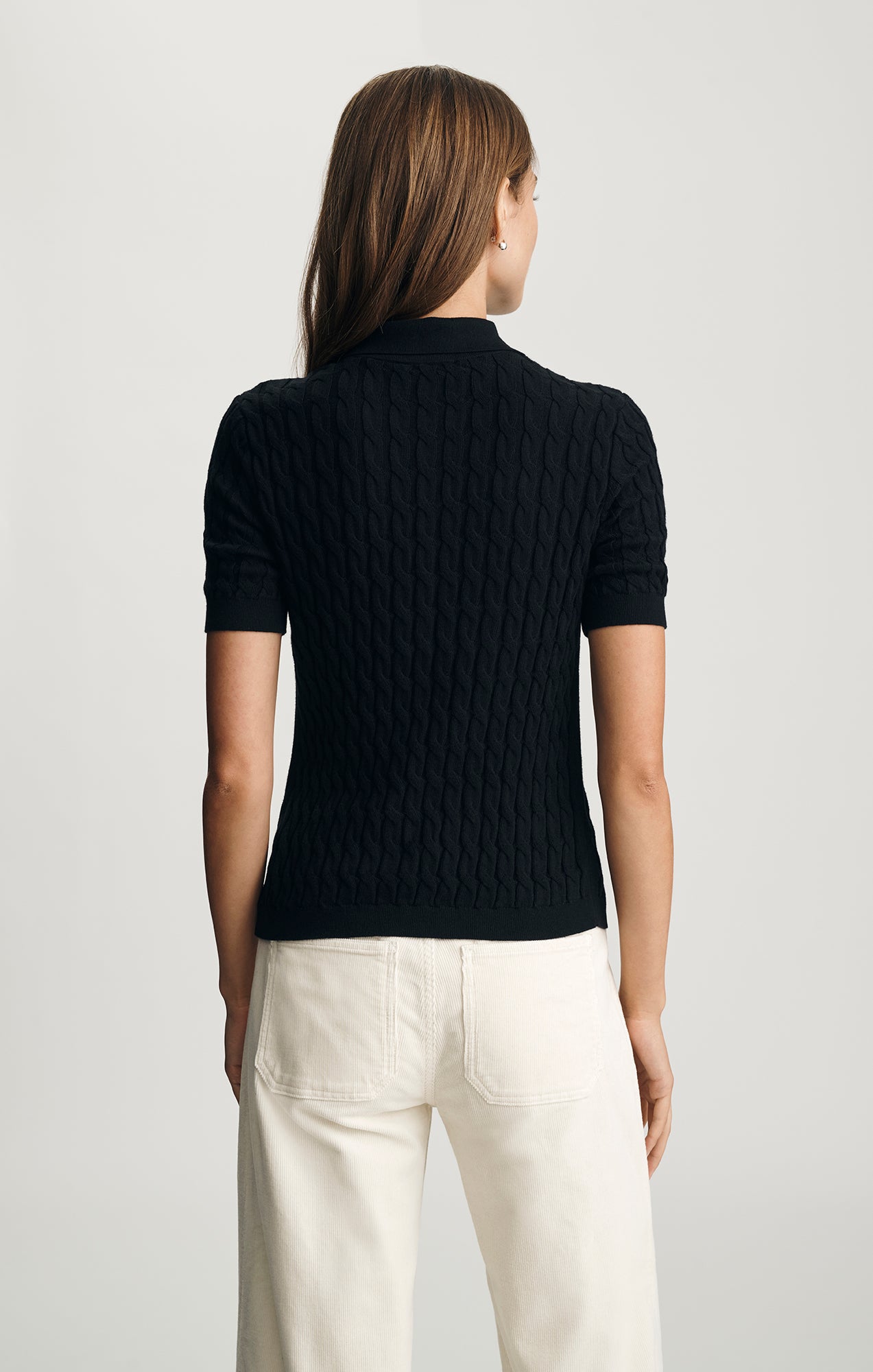 EDITION CABLE-KNIT POLO SWEATER IN BLACK