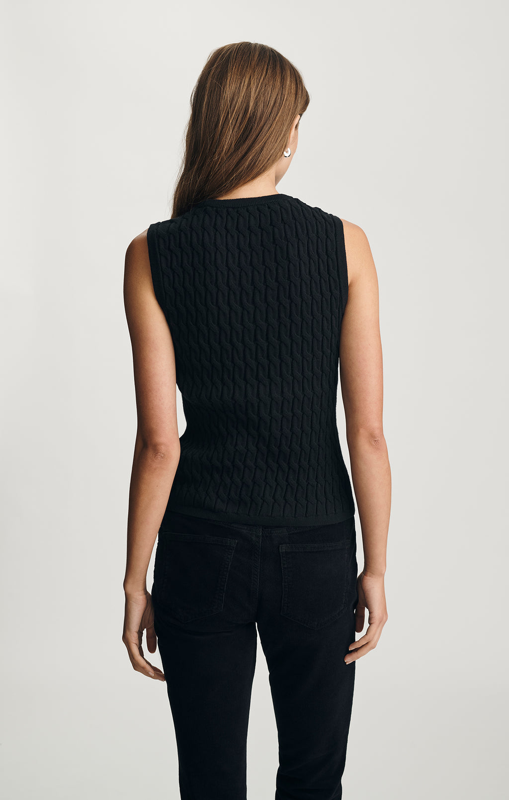 EDITION CABLE-KNIT SWEATER VEST IN BLACK